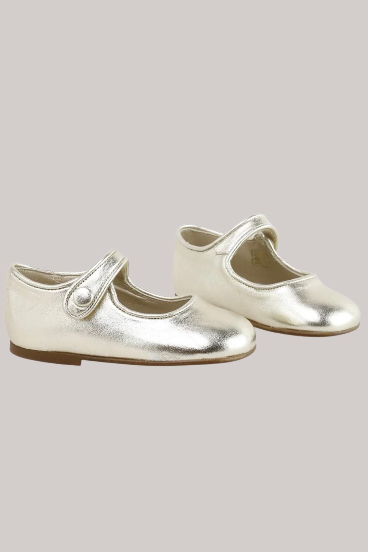Pair of golden shoes. 