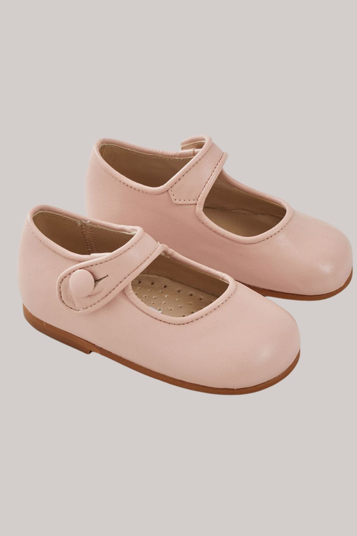 Baby Mary Jane - Pink - Strawberries & Cream - Ingrid Lewis - Designer 
Pair of pink children's shoes with brown soles.