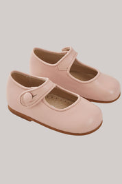 Baby Mary Jane - Pink - Strawberries & Cream - Ingrid Lewis - Designer 
Pair of pink children's shoes with brown soles.
