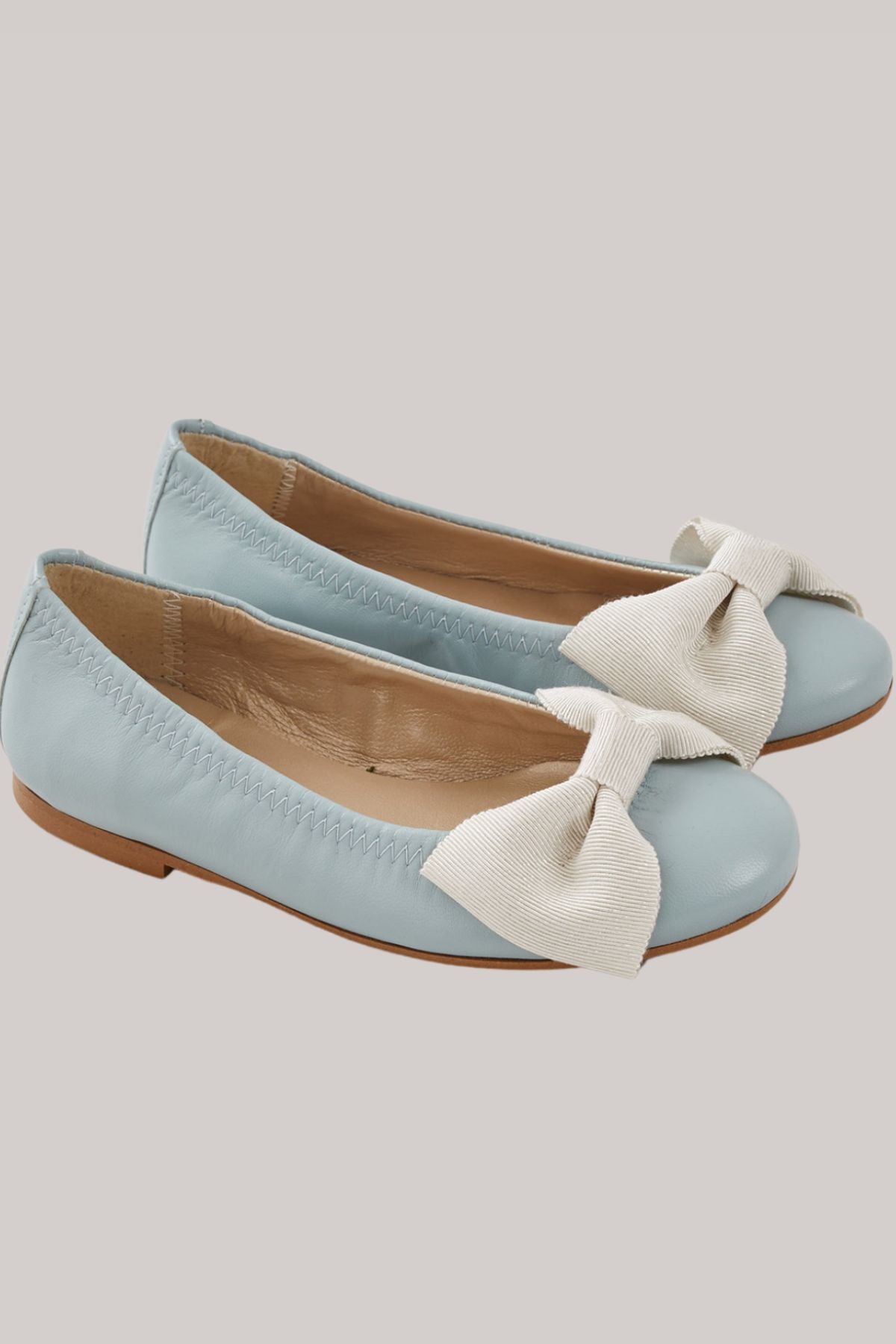 Ballerina Bow - Pastel Blue - Strawberries & Cream - Ingrid Lewis - Designer
Pair of light blue flats with white bows.