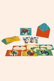 Djeco - 8 Invitations & Stickers - Pow! Bang! - Strawberries & Cream - Ingrid Lewis Colourful stationery set with envelopes and cards featuring superhero designs on a white background.