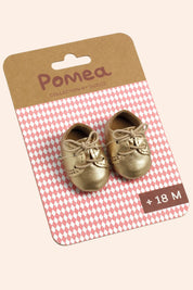 Djeco -  Gold shoes - Pomea - Strawberries & Cream - Ingrid Lewis - Designer 
Gold baby shoes on a Pomea packaging.