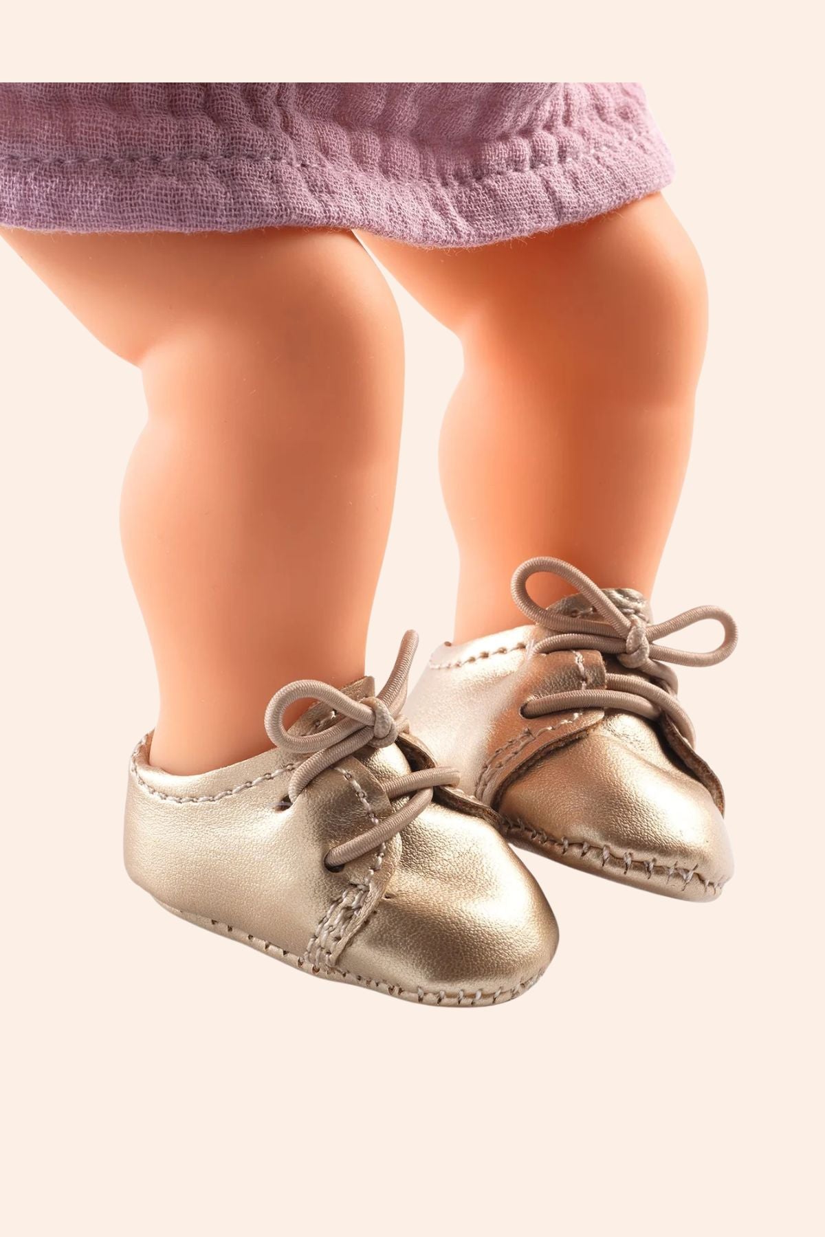 Djeco -  Gold shoes - Pomea - Strawberries & Cream - Ingrid Lewis - Designer
Baby doll  feet wearing golden shoes.
