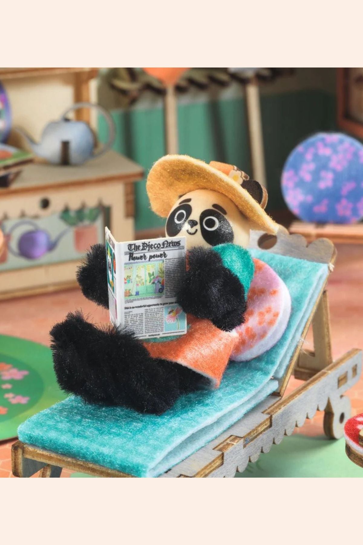 Djeco - Mi House - Olive - Strawberries & Cream 
Panda toy reading a newspaper on a deck chair.