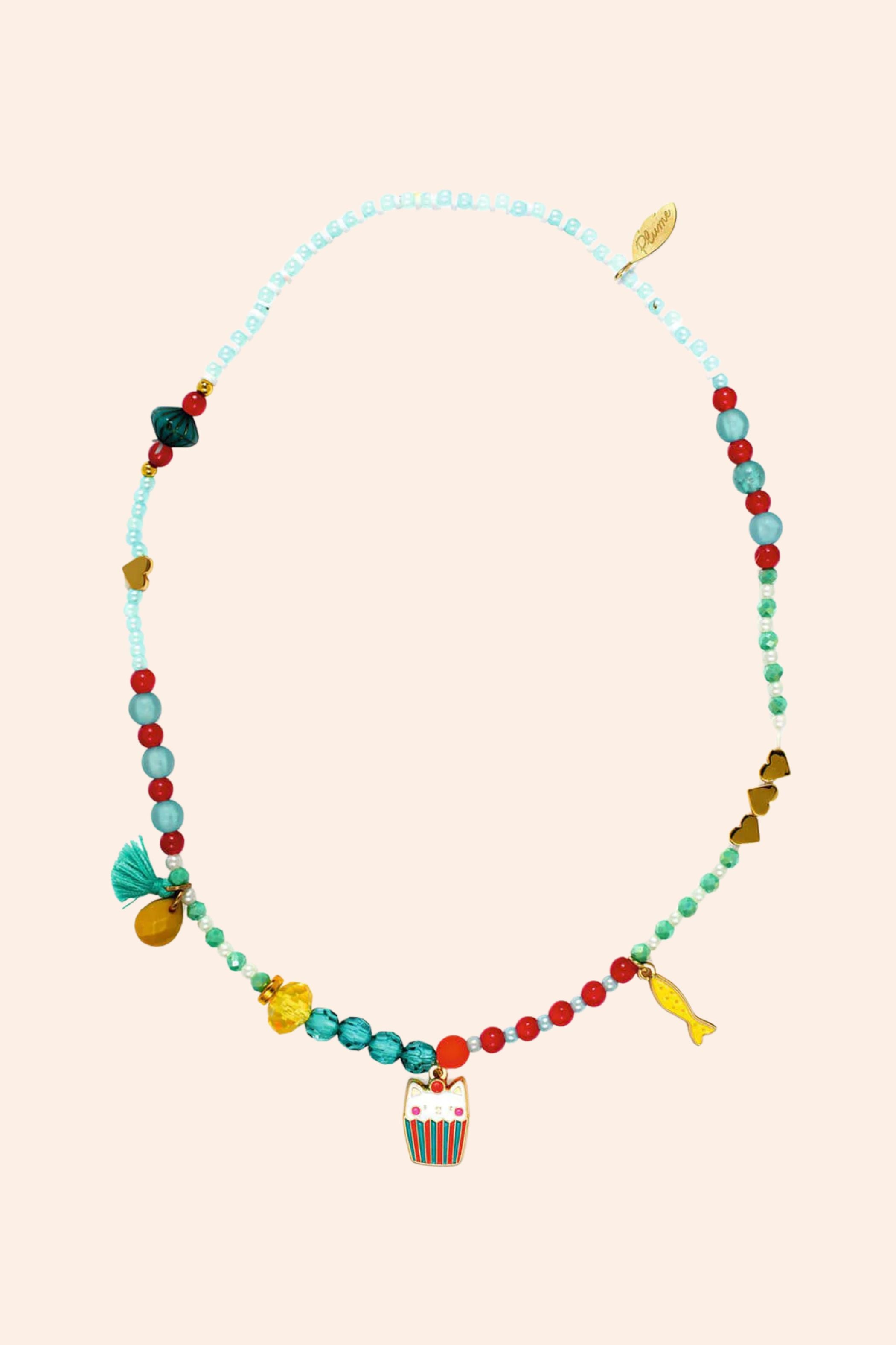 Djeco - Necklace - Mia - Strawberries & Cream - Ingrid Lewis - Designer
Colourful beaded necklace with owl charm on a beige background