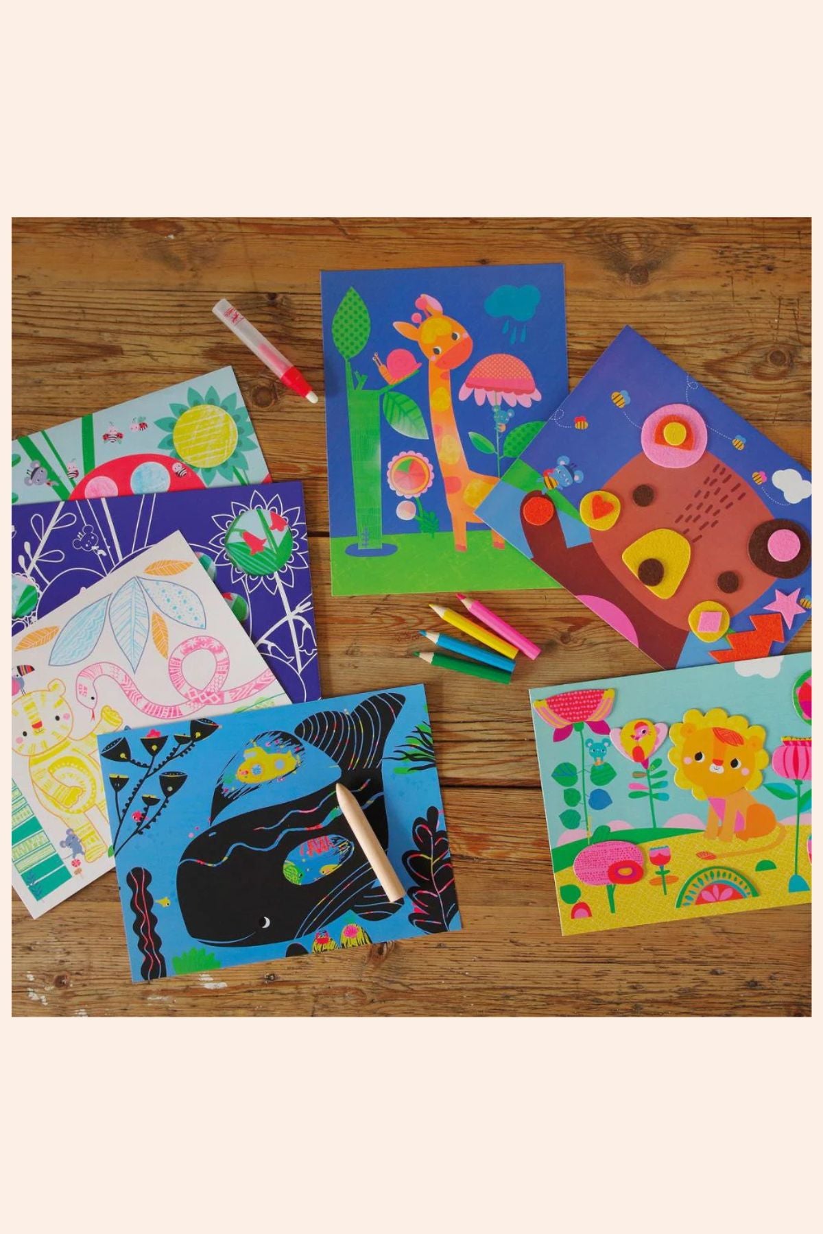 Djeco - The Mouse and His Friends - 6 Creative Activities - Strawberries & Cream - Ingrid Lewis - Designer
Colourful children's drawings on a wooden surface with markers and pencils.