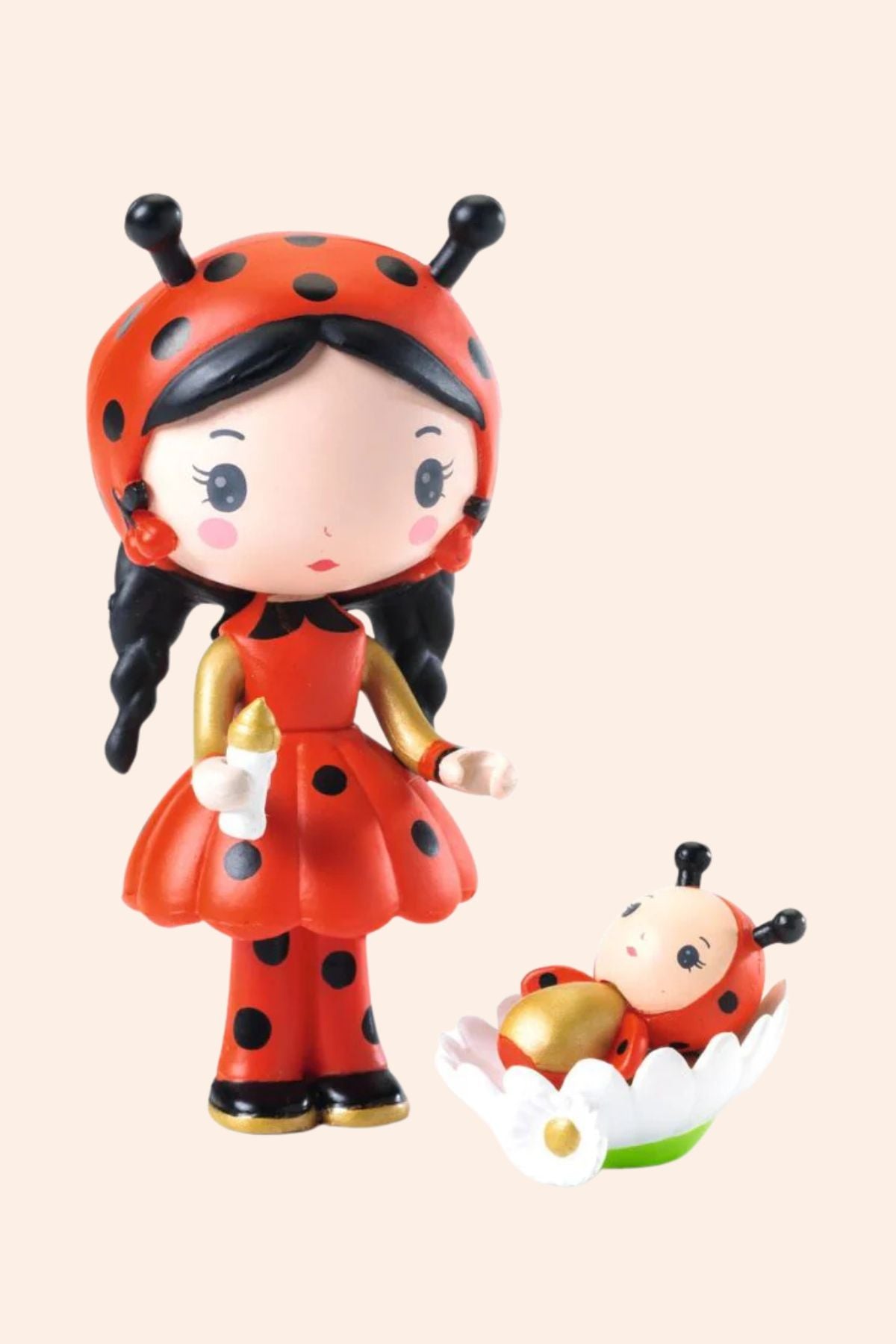 Toy figure of a ladybug girl with a smaller ladybug character. 