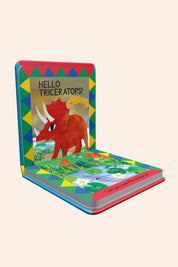 Children's book with a colourful cover featuring a triceratops illustration on a white background