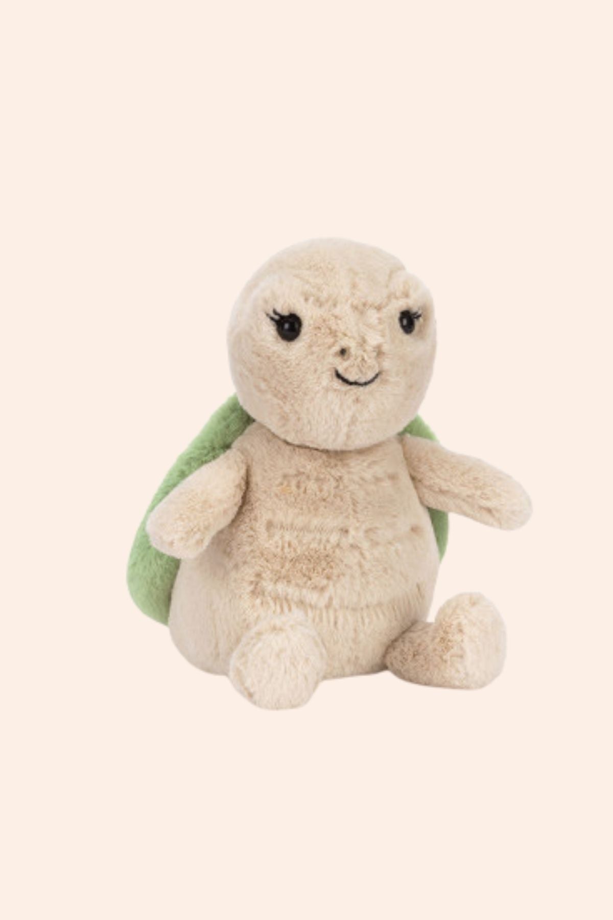 Plush turtle toy with a green shell on a white background