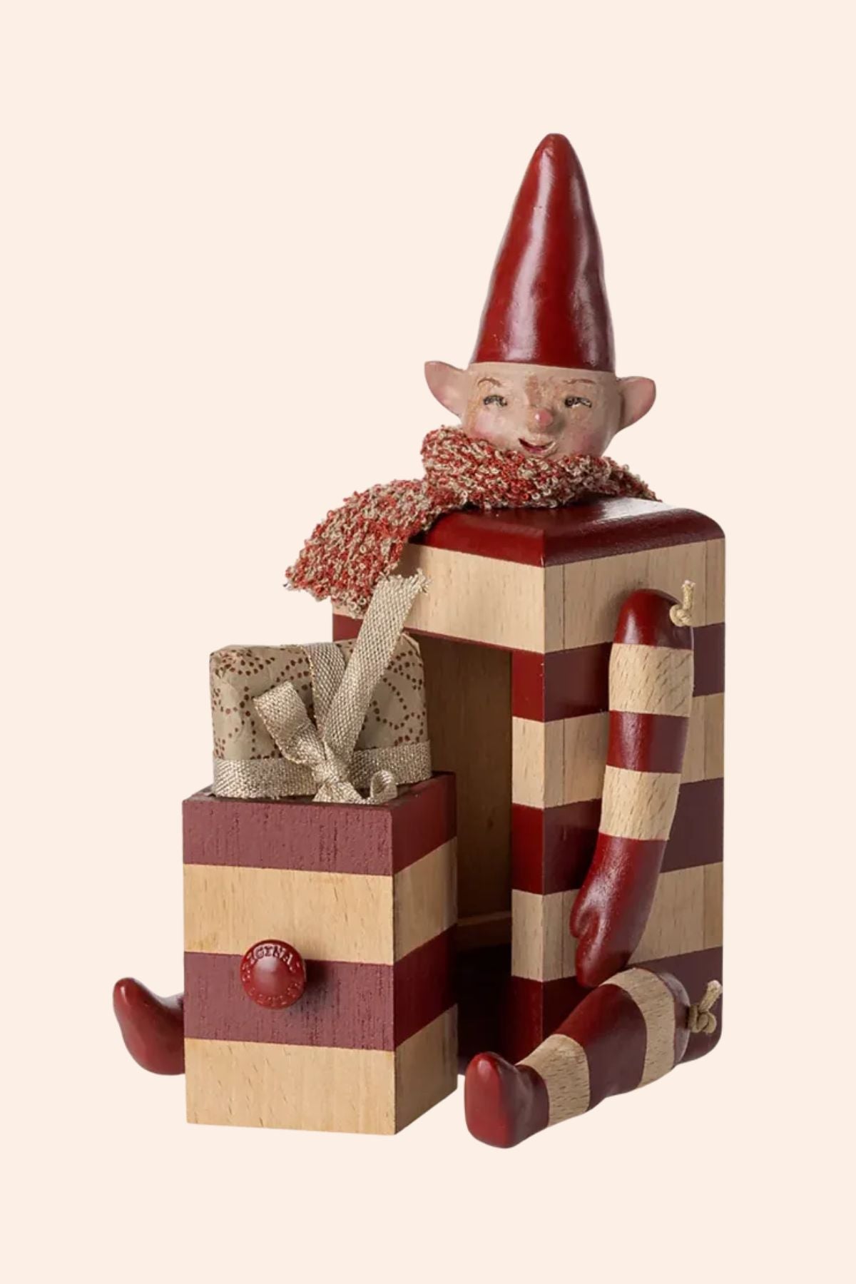 Maileg - Pixy with Drawer - Red - Strawberries & Cream - Ingrid Lewis - Designer
 Wooden elf figurine with a red hat and scarf, sitting on stacked gift boxes.