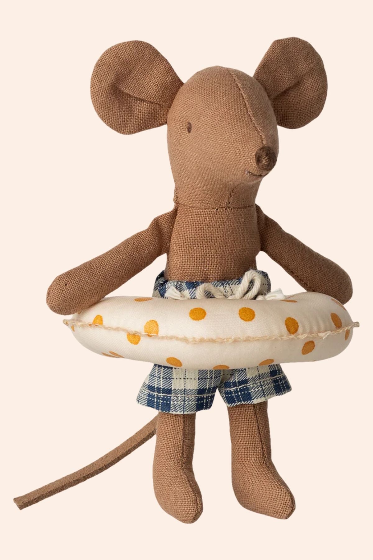 Stuffed mouse toy with a life buoy and plaid shorts on a beige background