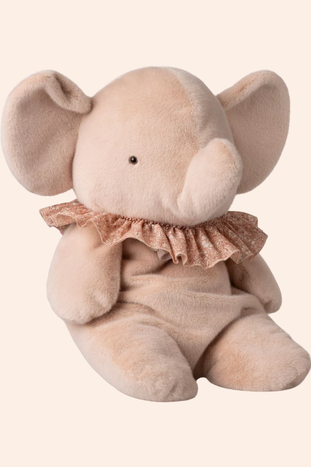 Plush elephant toy with a ruffled collar on a white background