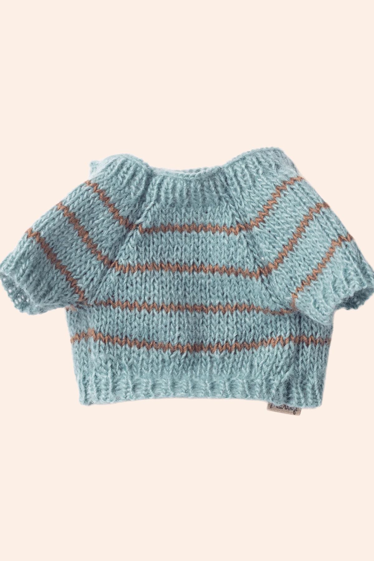 Knitted blue sweater with brown stripes on a beige background