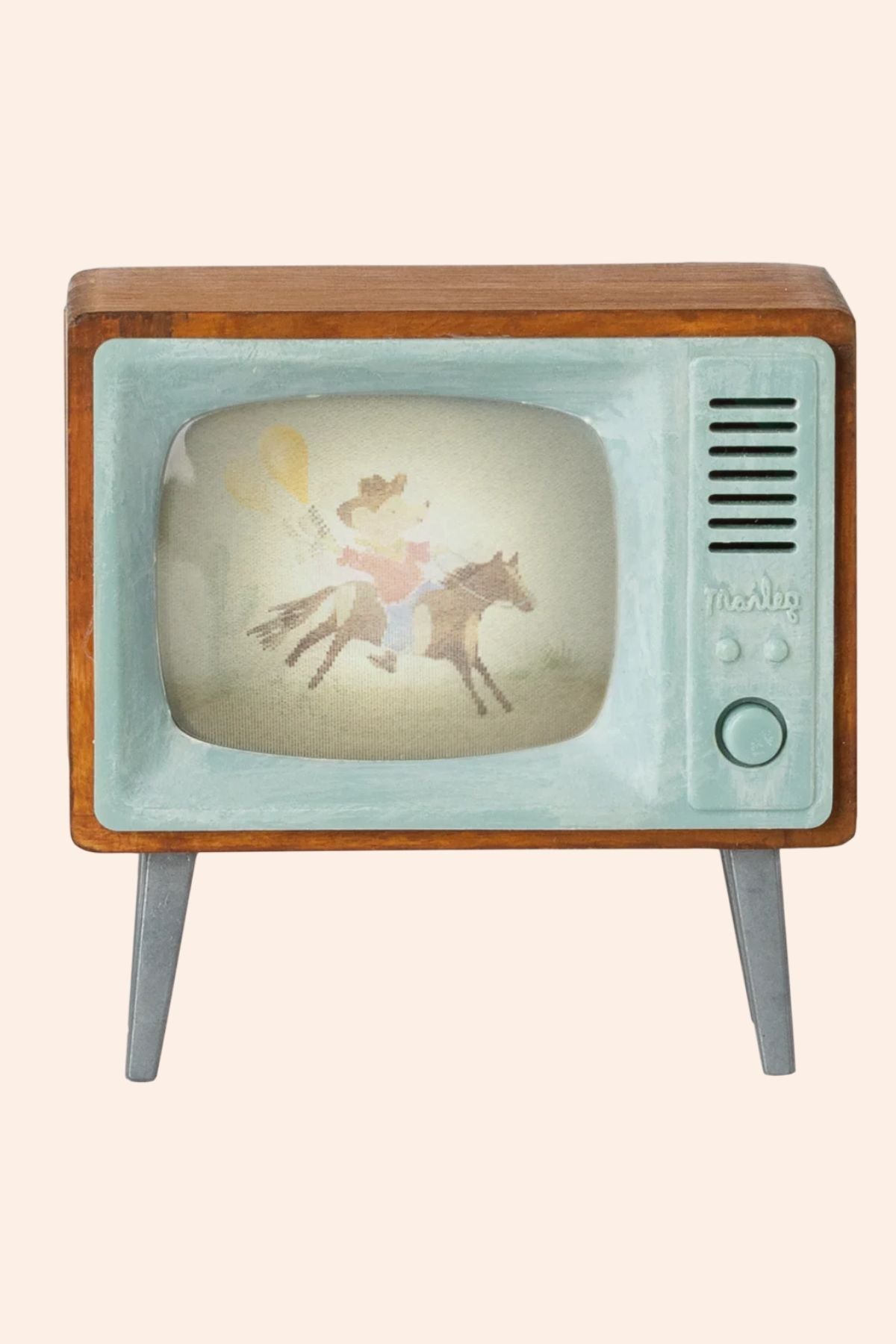 Vintage television set with a fairy on a horse on the screen against a white background
