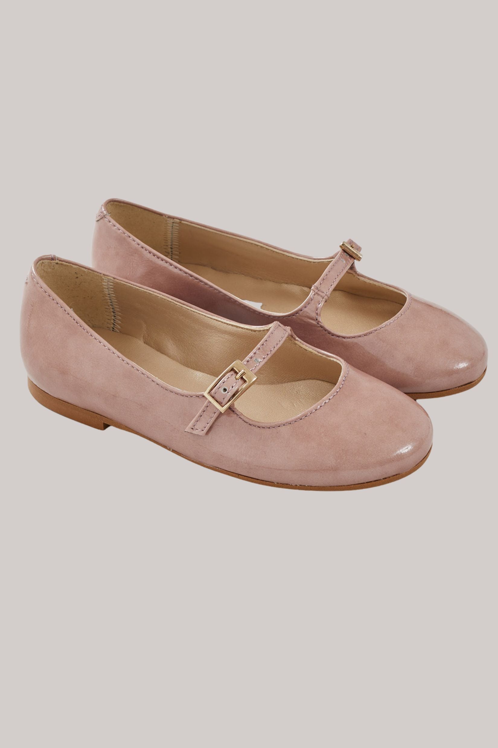 Mary Jane - Patent Leather Dusty Pink - Strawberries & Cream - Ingrid Lewis - Designer 
Pair of pink Mary Jane shoes.