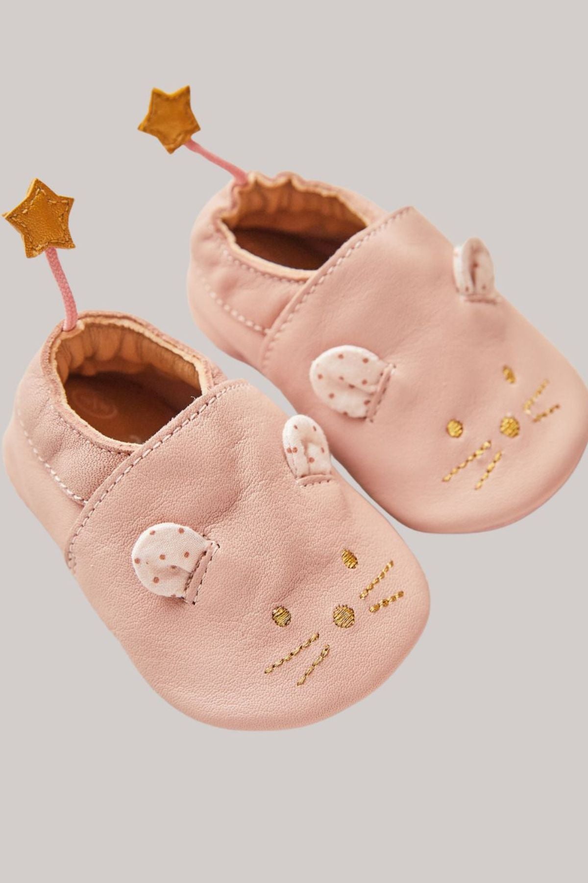 Moulin Roty - Pink Leather Mouse Slippers - Strawberries & Cream - Ingrid Lewis - Designer 
Pair of pink baby shoes with star and heart designs