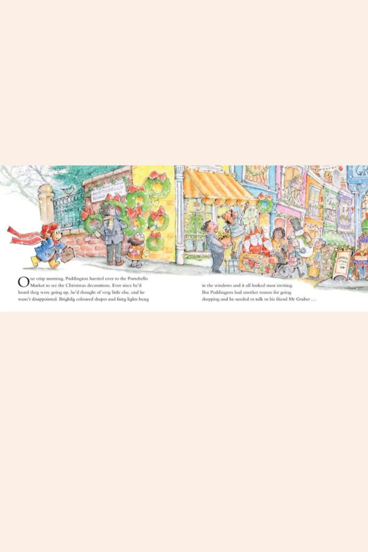 Illustration of a snowy street scene with people and shops, featuring Paddington in a red coat.