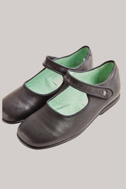 Papouelli - Black Leather - Strawberries & Cream - Ingrid Lewis - Designer  Pair of black shoes with green lining 