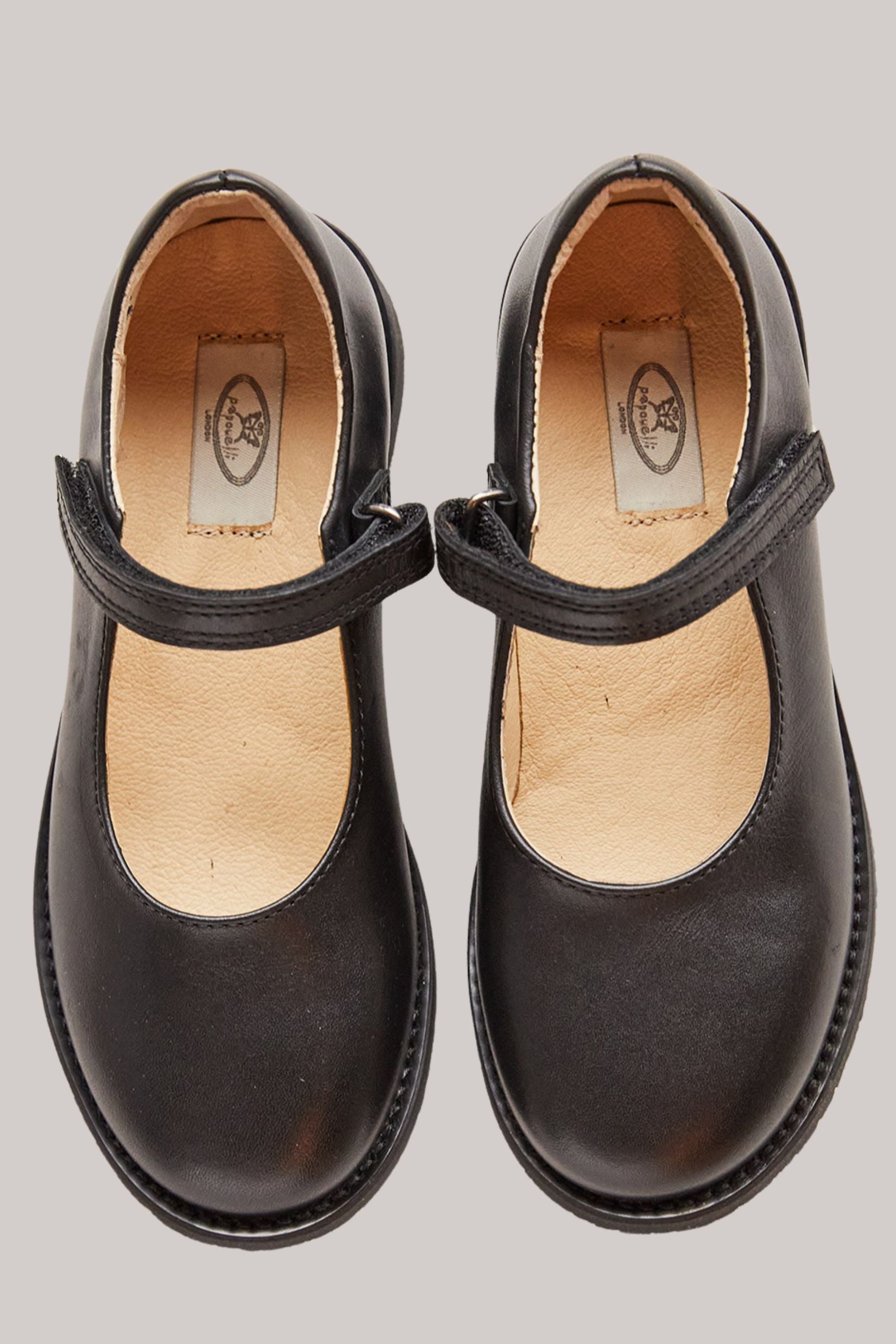 Papouelli - Emilia Strap Black - Strawberries & Cream - Ingrid Lewis - Designer
Pair of black children's shoes with a strap