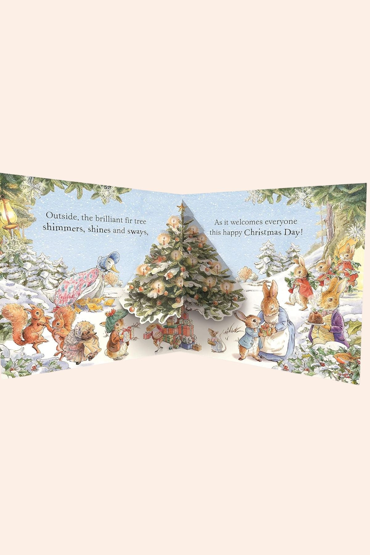 Peter Rabbit: Happy Christmas Peter! - Ingrid Lewis -Designer - Strawberries & Cream 
Illustrated Christmas scene with animals around a decorated tree.