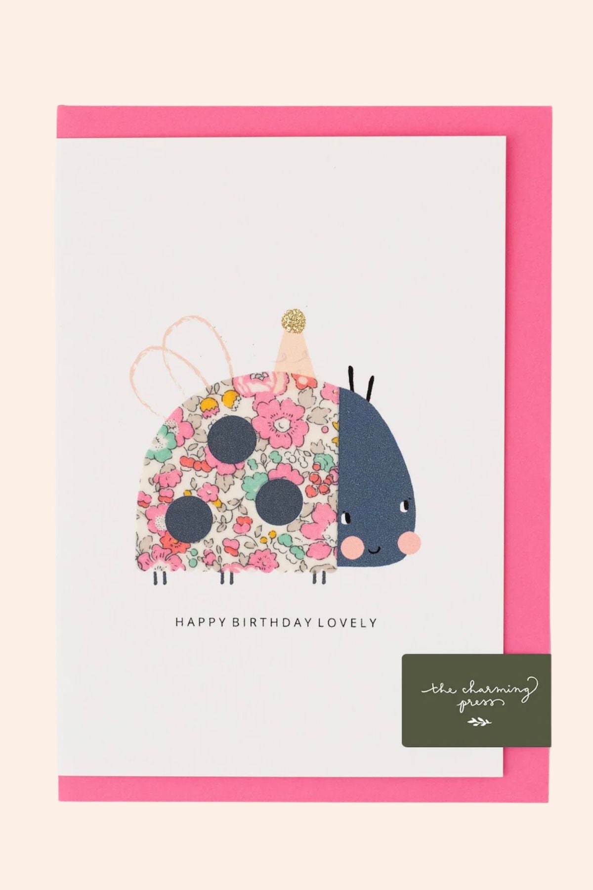 Greeting card with a floral ladybug design and 'Happy Birthday Lovely' text on a pink border.