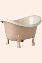 Beige baby bathtub with white interior on a white background